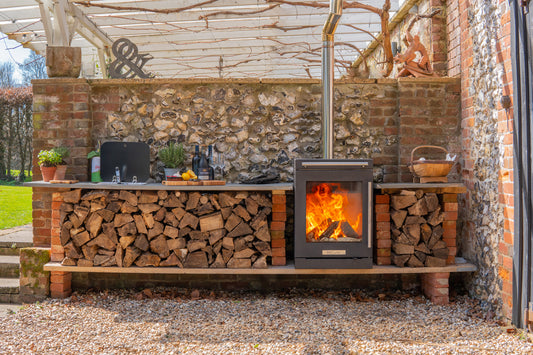 BBQube wood-burning stove and barbecue integrated into an outdoor kitchen