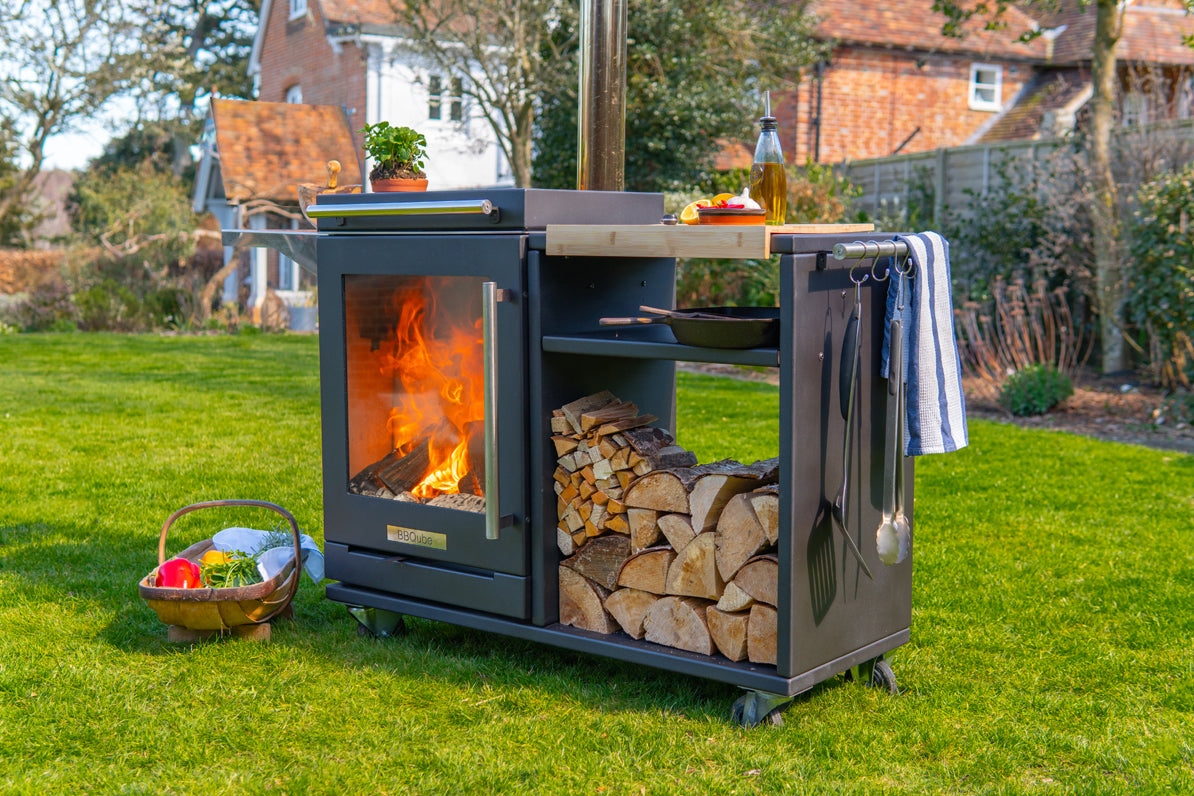 BBQube Log Store alongside BBQube outdoor wood-burning stove and barbecue