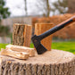 chopping wood for wood burning stove by BBQube