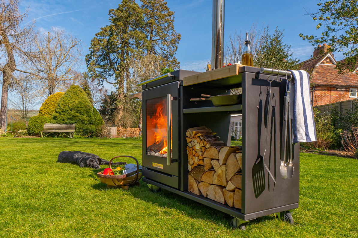BBQube Log Store alongside BBQube outdoor wood-burning stove and barbecue